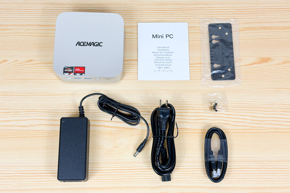 ACEMAGIC Kron Mini K1の同梱物。説明書やACアダプタ、VESAマウントブラケットなどが見える